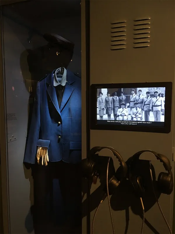 Locker room with a screen displaying films about gendarmes.